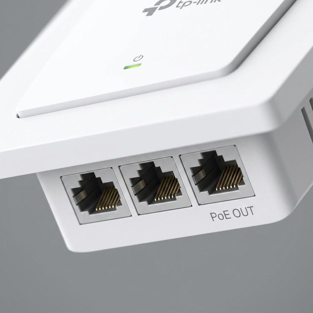Macro view of TP-Link EAP615-Wall access point bottom showing three Ethernet ports and PoE OUT.